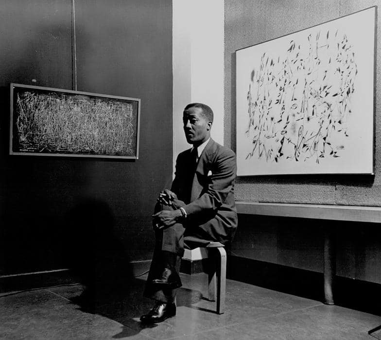 Norman Lewis with his abstract art, ca. 1950