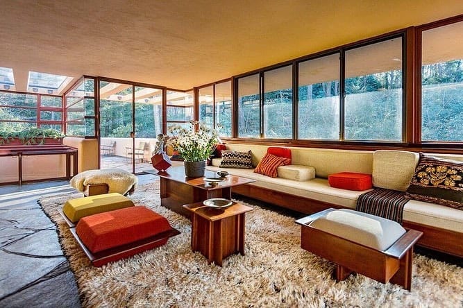 Living room of Frank Lloyd Wright's Fallingwater, a total work of art embracing its surrounding nature.
