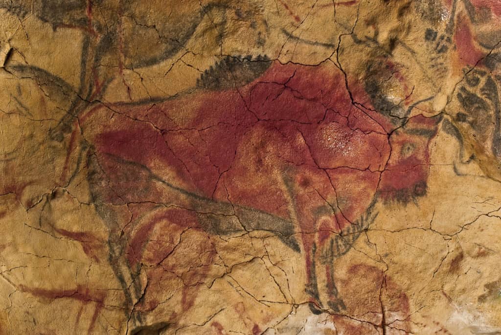 Bison painted in red ochre at the Altamira Cave in Santillana del Mar, Spain (around 15000 BC)