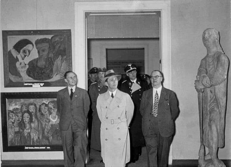Joseph Goebbels, Reich Minister for Public Enlightenment and Propaganda, walking in the Degenerate Art Exhibition in Munich, 1937