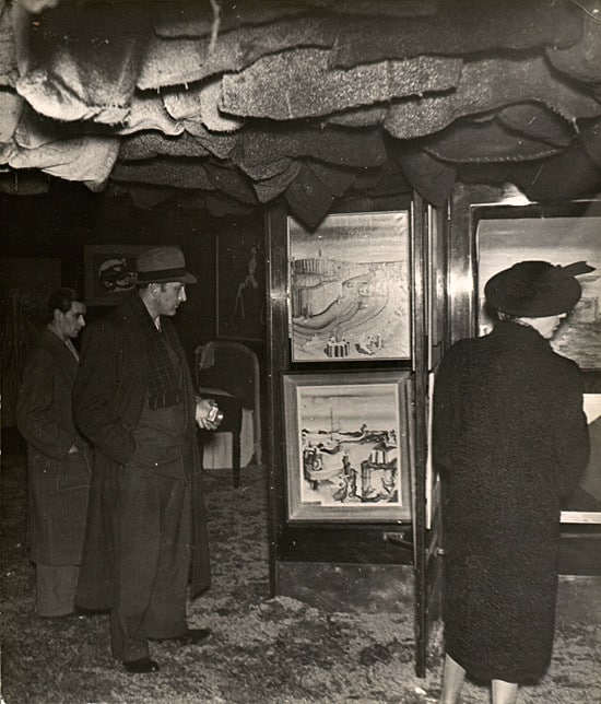 Visitors with flashlights at the International Surrealist Exhibition, Paris, 1938
