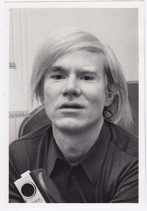 Andy Warhol carrying his Sony Portapak in London in 1971, at the time he began to explore the video medium. Unknown photographer.