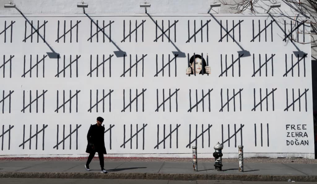 Art Censorship. NA man walks by a mural by artist Banksy supporting  jailed Turkish artist Zehra Dogan on April 18, 2018 in New York City. (Photo by Gary Hershorn)