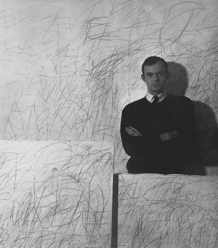 Cy Twombly with his artworks