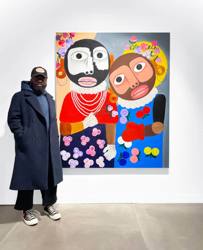 Kojo Marfo with his painting titled Offspring.