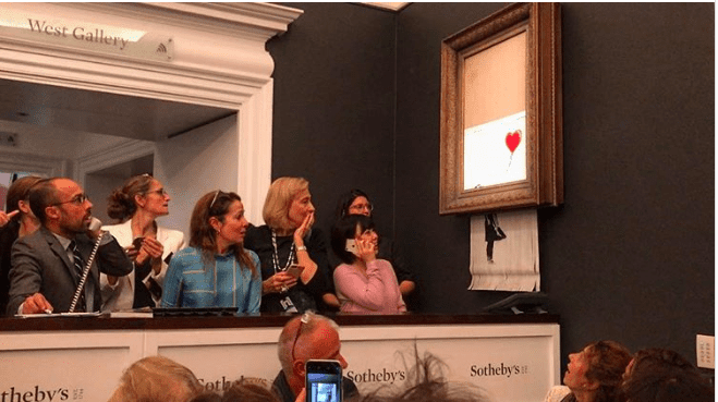 Girl with baloon; Banksy painting shredded at Sotheby's