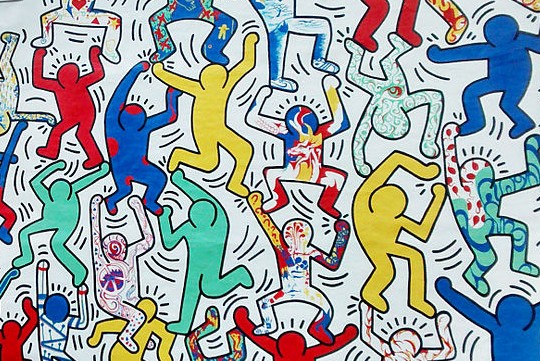 Detail from We Are The Youth, a work of street art by Keith Haring in Philadelphia showing his famous dancing figures.