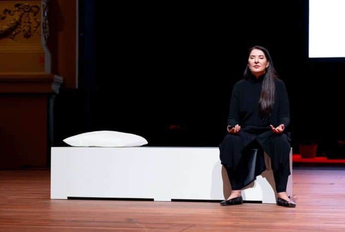 Marina Abramović guides the audience in performance exercises during No Intermission