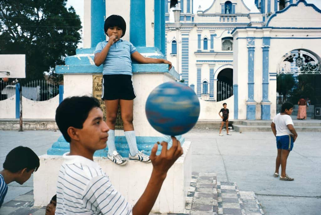 Alex Webb, Children playing in a courtyard, from La Calle: Photographs from Mexico, 1985